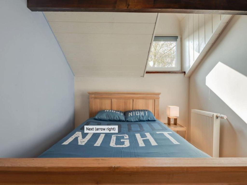 a bedroom with a bed in a attic at Holiday Home between Spa and Eifel Nature Park in Xhoffraix