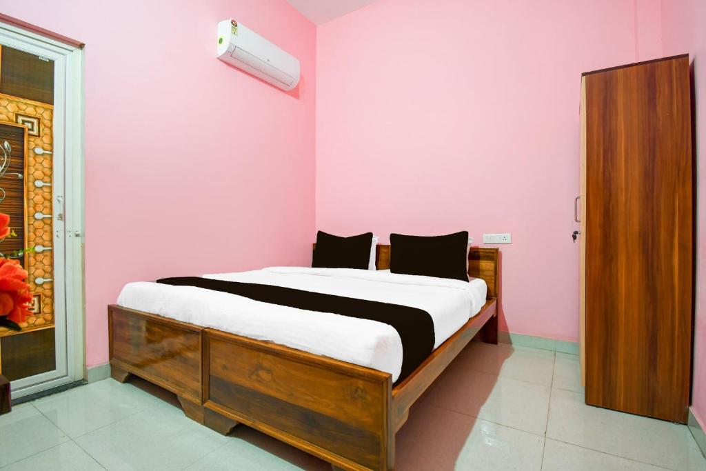 Postel nebo postele na pokoji v ubytování Hotel O Moon Guest House