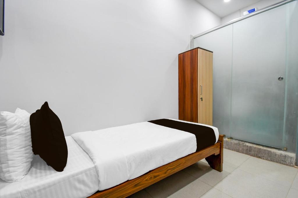 Postel nebo postele na pokoji v ubytování Hotel O Moon Guest House
