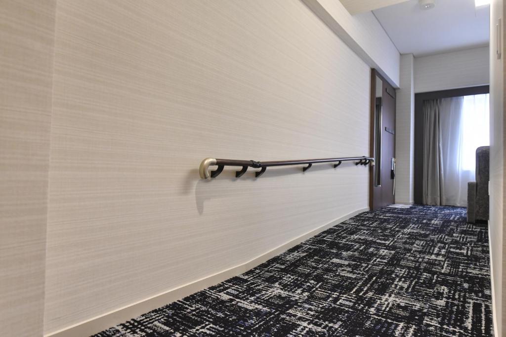 Tempat tidur dalam kamar di Hotel New Otani Tottori
