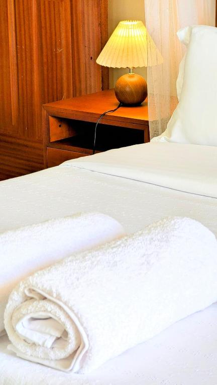 Postel nebo postele na pokoji v ubytování Ahva III Residence