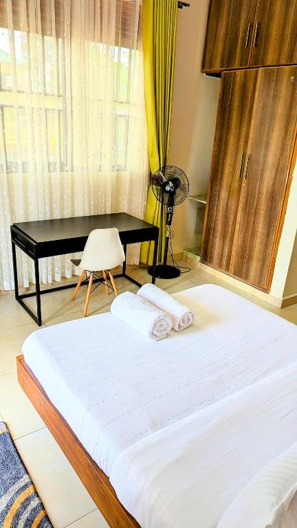 Postel nebo postele na pokoji v ubytování Ahva III Residence