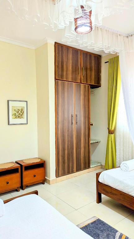 Postel nebo postele na pokoji v ubytování Ahva III Residence
