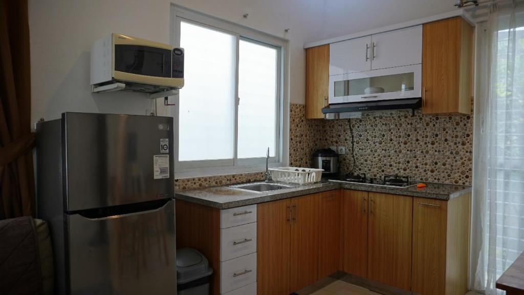 Kuchyň nebo kuchyňský kout v ubytování Diyar Villas Puncak M4/12