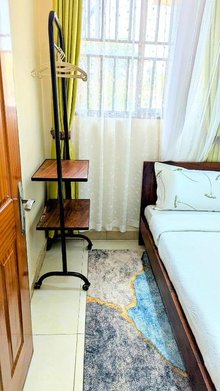 Postel nebo postele na pokoji v ubytování Ahva III Residence
