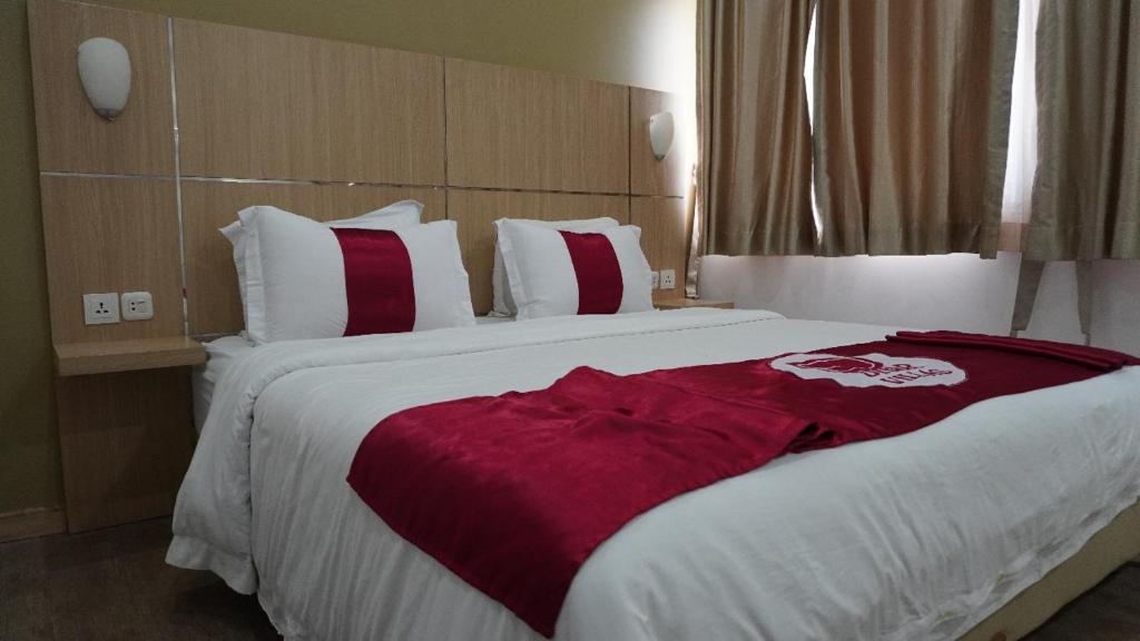 Postel nebo postele na pokoji v ubytování Diyar Villas Puncak K3/2A