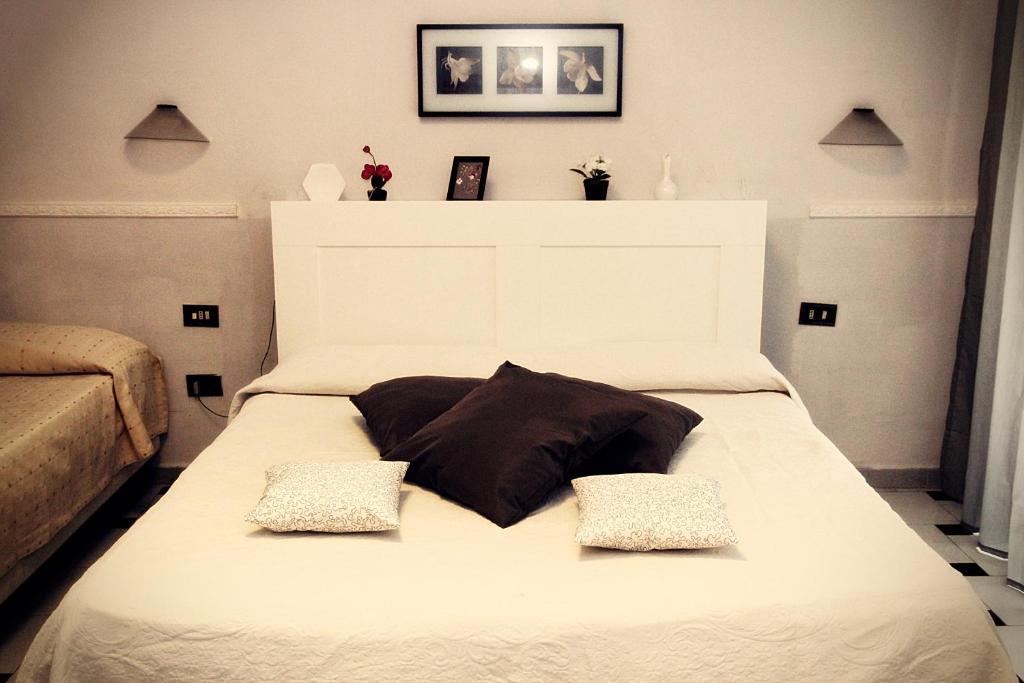 Postel nebo postele na pokoji v ubytování Hotel Luna Rossa