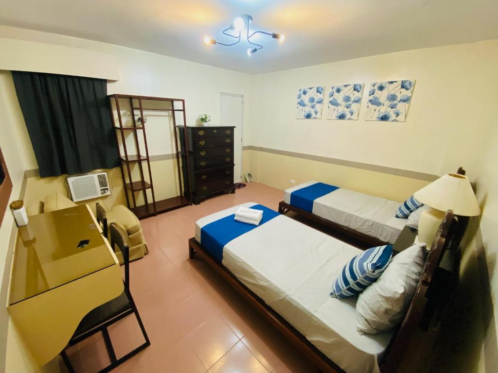 Postel nebo postele na pokoji v ubytování Jupiter Homestay