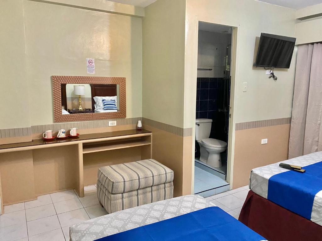 Postel nebo postele na pokoji v ubytování Jupiter Homestay