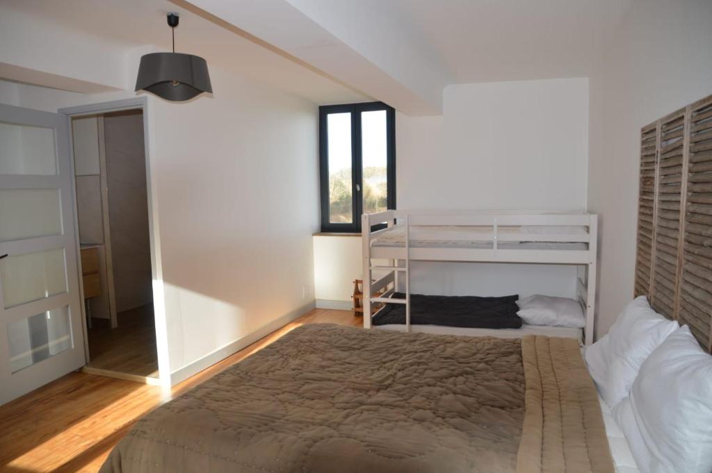 Ένα ή περισσότερα κρεβάτια σε δωμάτιο στο Chambres à la ferme