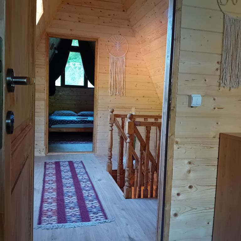 Postel nebo postele na pokoji v ubytování Căbănuțe Izbândiș