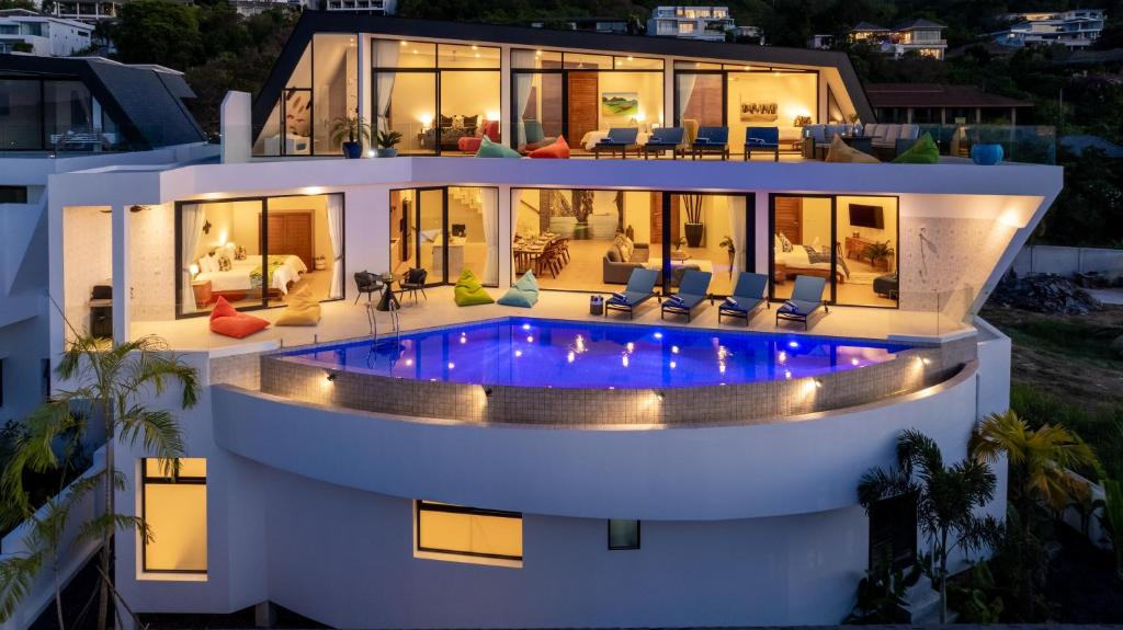 a house with a swimming pool at night at Blue Pearl Villa - Brand new luxury awaits in Koh Samui 
