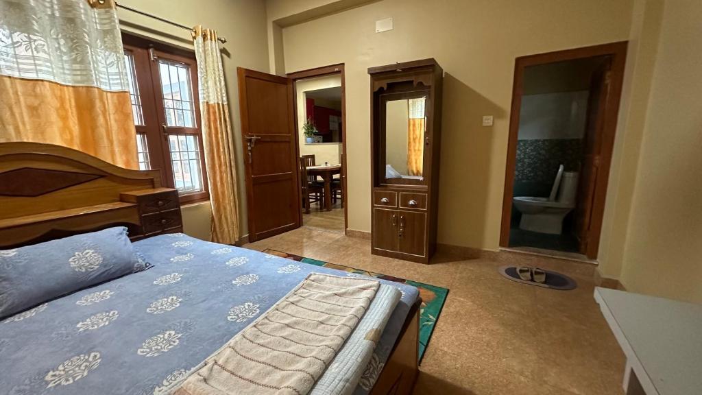 Postel nebo postele na pokoji v ubytování Chitwan Comforts Apt 1 Room 1