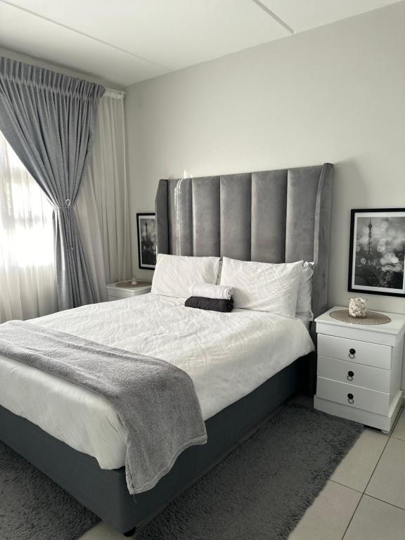 Ένα ή περισσότερα κρεβάτια σε δωμάτιο στο Apollo luxury 2 bedroom