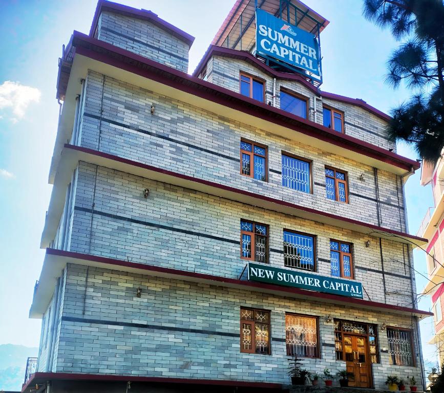 a building with a sign on top of it at New Summer Capital in Shimla