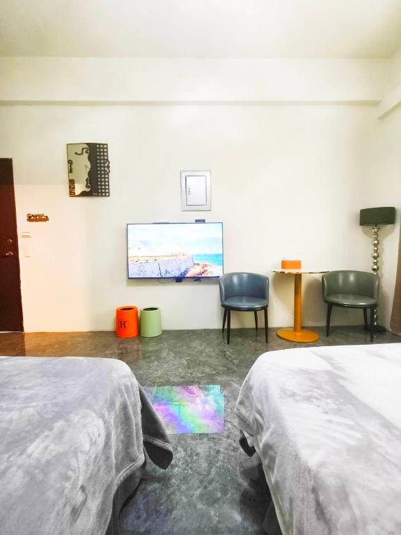Postel nebo postele na pokoji v ubytování Jing Cheng Homestay