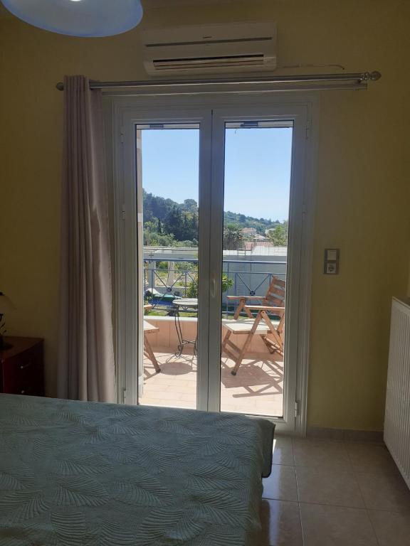 Кровать или кровати в номере SIMOS' sea view house