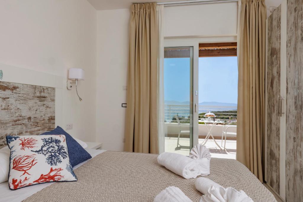 Letto o letti in una camera di Mercury Beach Hotel