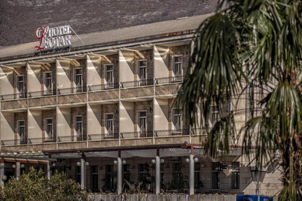 a building with balconies on the side of it at Hotel Leotar in Trebinje