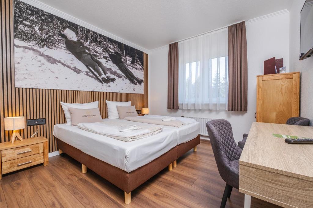 Postel nebo postele na pokoji v ubytování Hotel Winterberg Resort