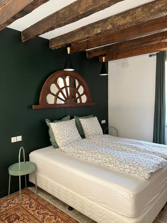Postel nebo postele na pokoji v ubytování Moulin A