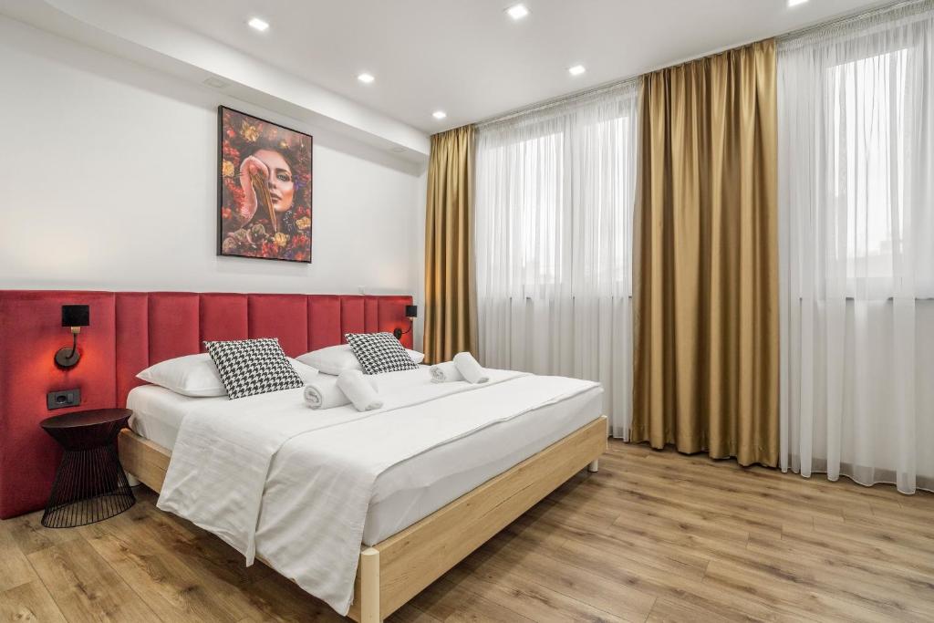 Łóżko lub łóżka w pokoju w obiekcie Hotel National