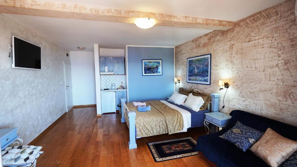 TV a/nebo společenská místnost v ubytování Medin Apartments BluVista