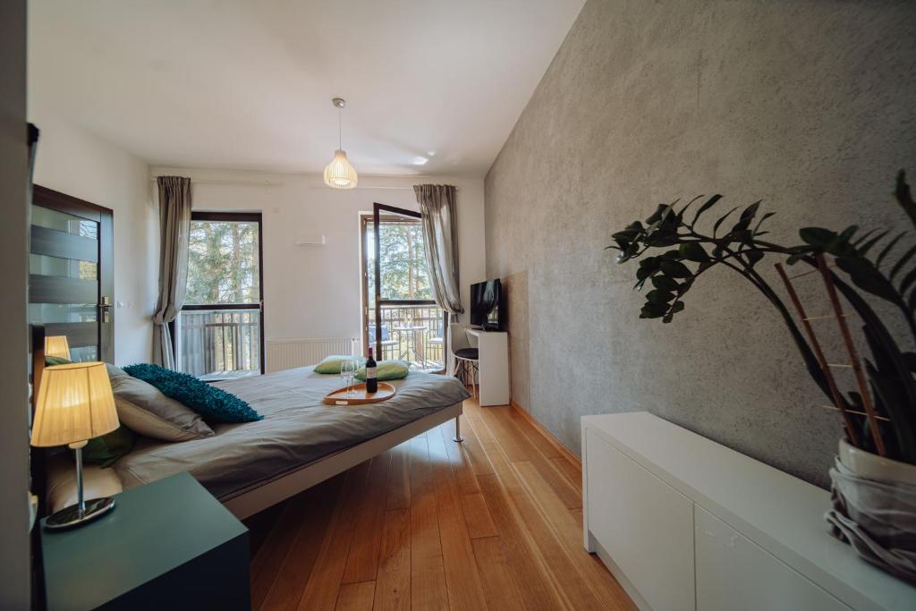 Posteľ alebo postele v izbe v ubytovaní Panorama Gór - Centrum Miasta, Apartament z widokiem na Szrenicę