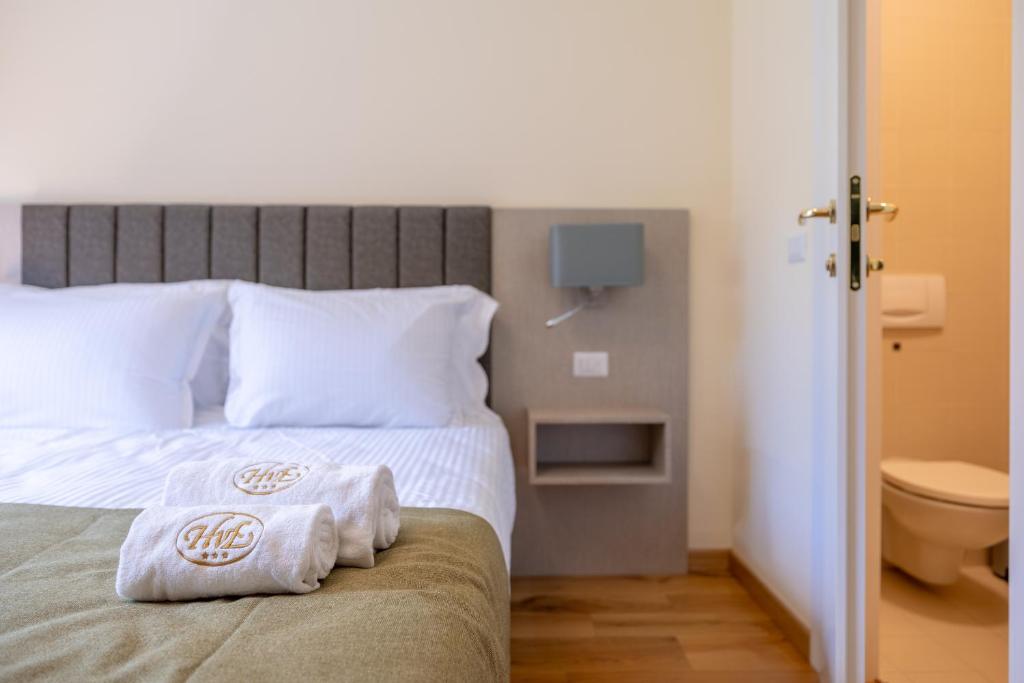 A bed or beds in a room at Albergo Villa Edy
