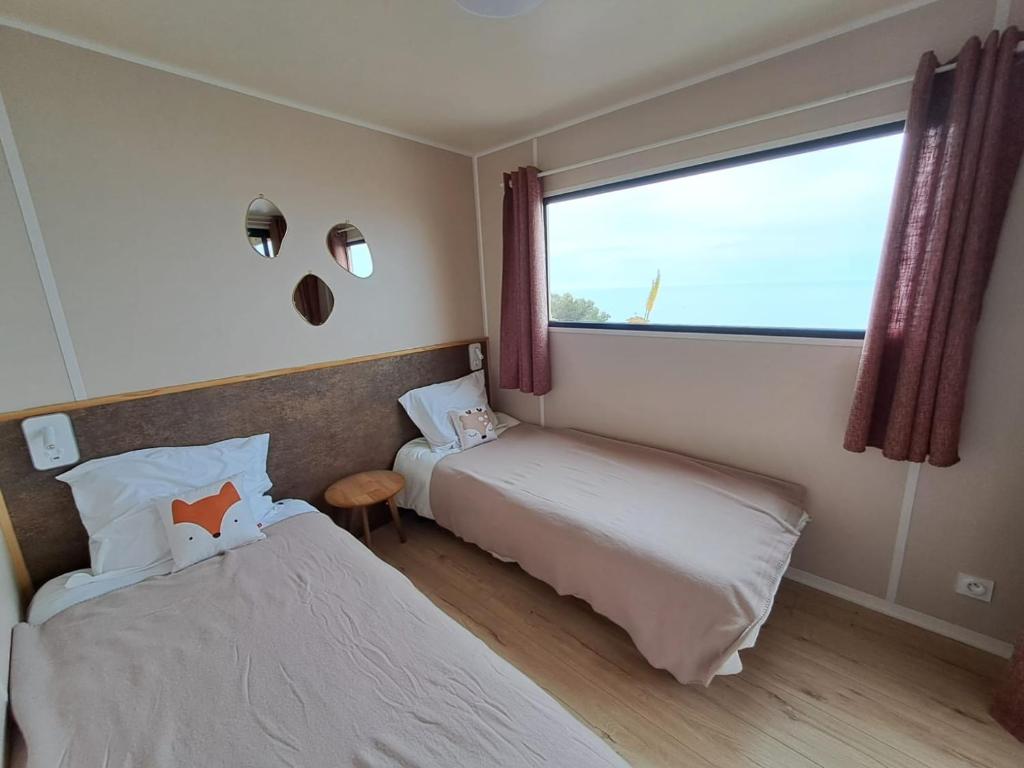Postel nebo postele na pokoji v ubytování Chalet avec vue mer splendide