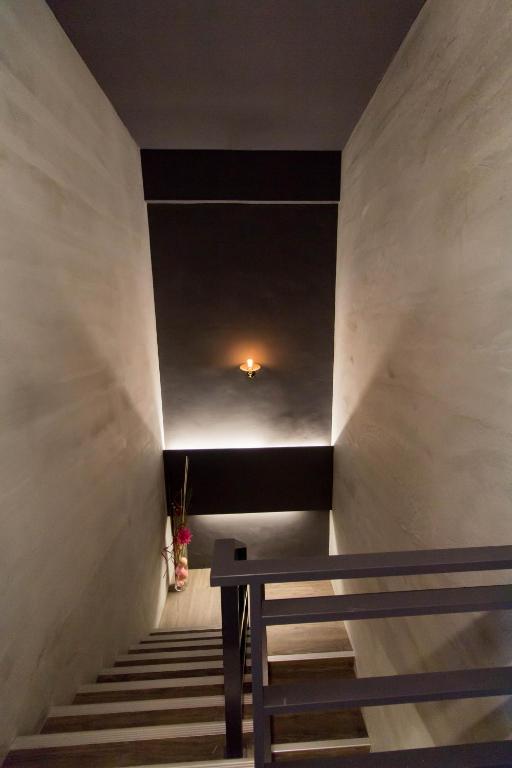 a stairway with a bench in a room at Book 5 in Dongshan