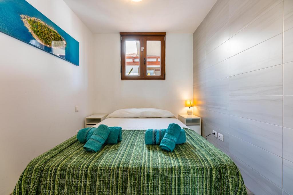 A bed or beds in a room at Casa Esmeralda