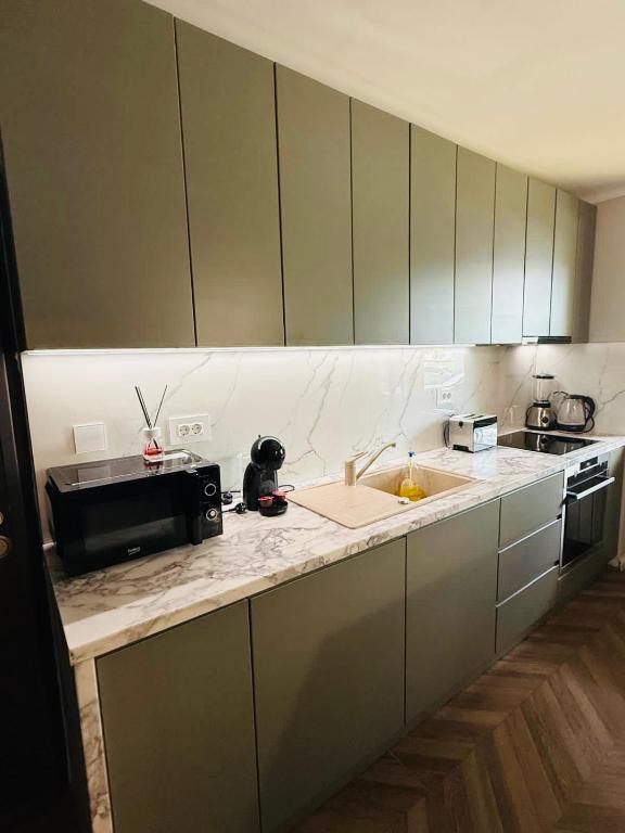 Kuchyň nebo kuchyňský kout v ubytování Apart Central