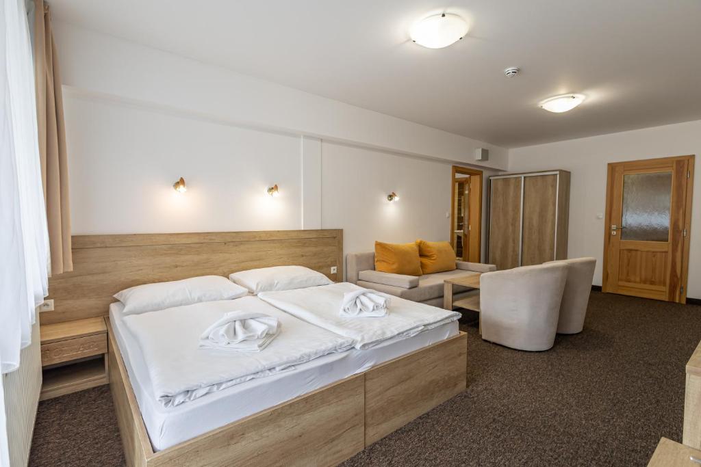 Postel nebo postele na pokoji v ubytování Hotel Toliar