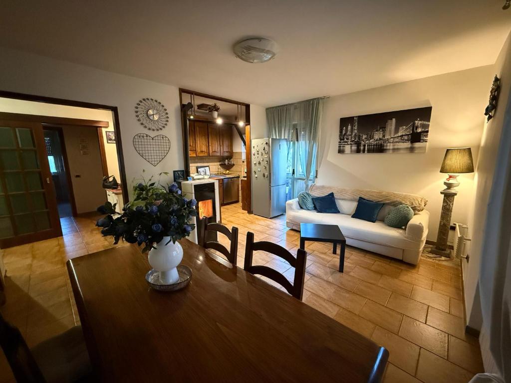 a living room with a table and a couch at Anna's House in Arcidosso