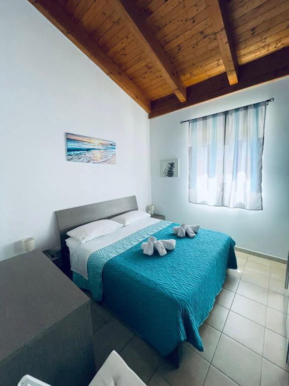 Postel nebo postele na pokoji v ubytování Casa Caretta