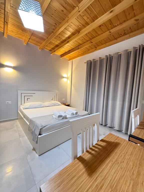 Postel nebo postele na pokoji v ubytování Maison Apartments