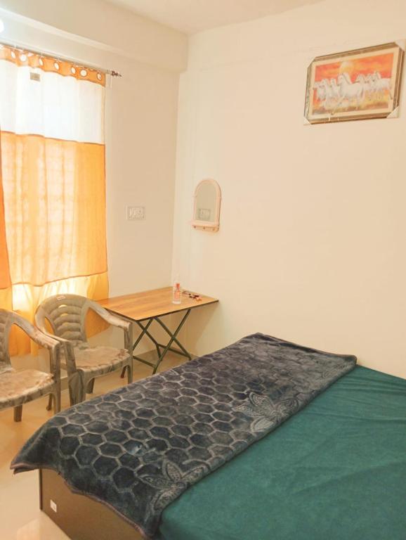 Postel nebo postele na pokoji v ubytování Mamta Home Stay
