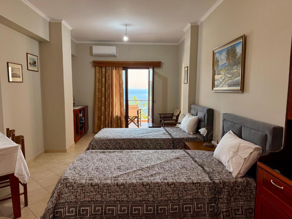 Postel nebo postele na pokoji v ubytování Mitro Guesthouse