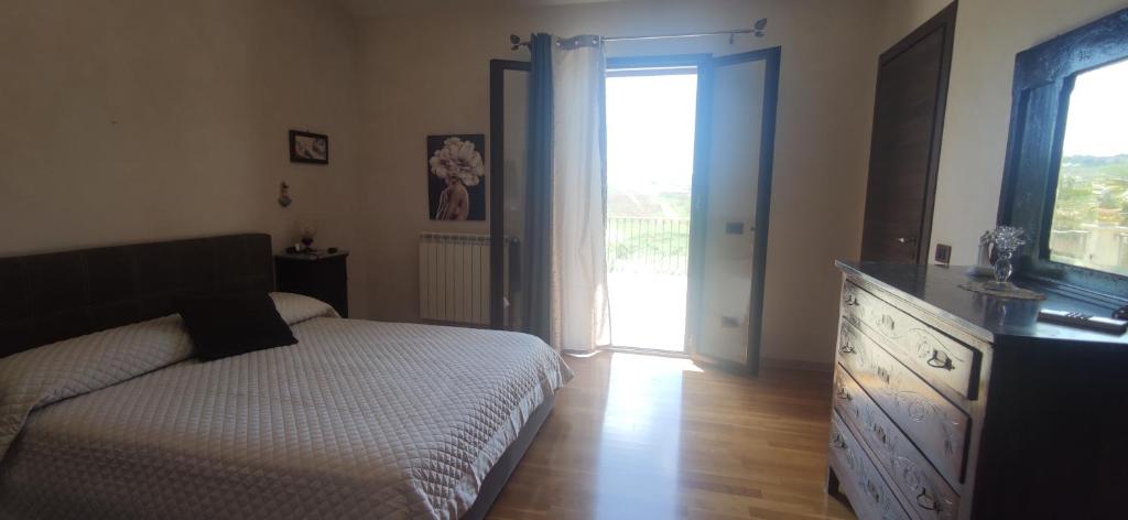 Postel nebo postele na pokoji v ubytování B&B Della Via Francigena