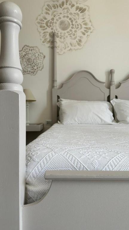 Postel nebo postele na pokoji v ubytování Palazzo Conti Camere & Suites