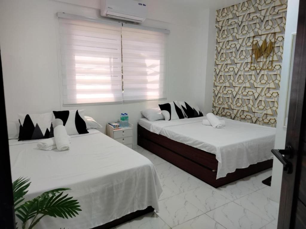 Voodi või voodid majutusasutuse Marias Transient Family Room toas