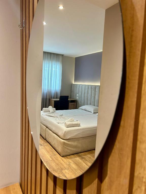 Postel nebo postele na pokoji v ubytování Guza Apartments