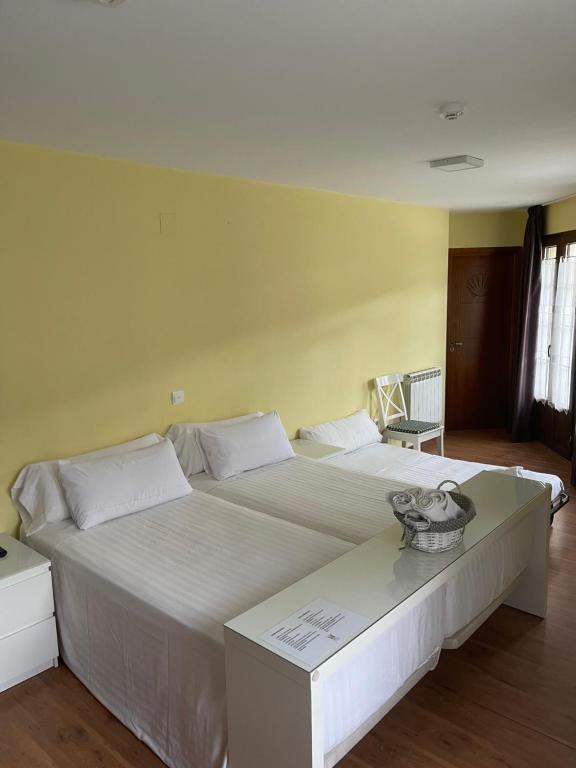 Postel nebo postele na pokoji v ubytování The Way Hotel Molinaseca