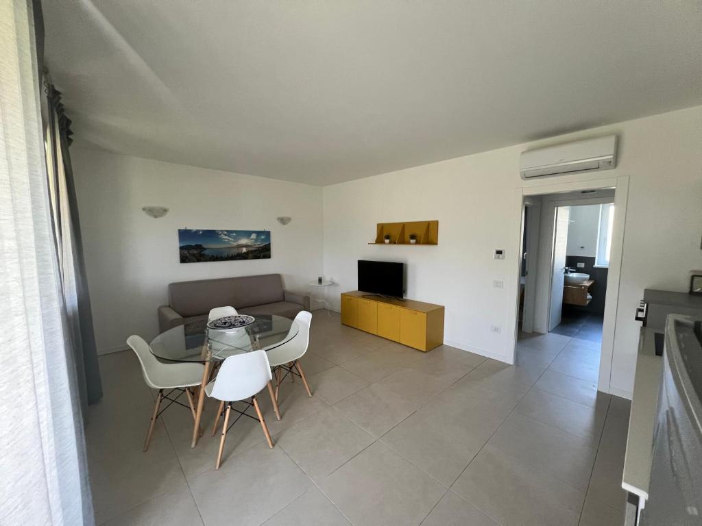 Televízia a/alebo spoločenská miestnosť v ubytovaní Val Mora Bio Apartments