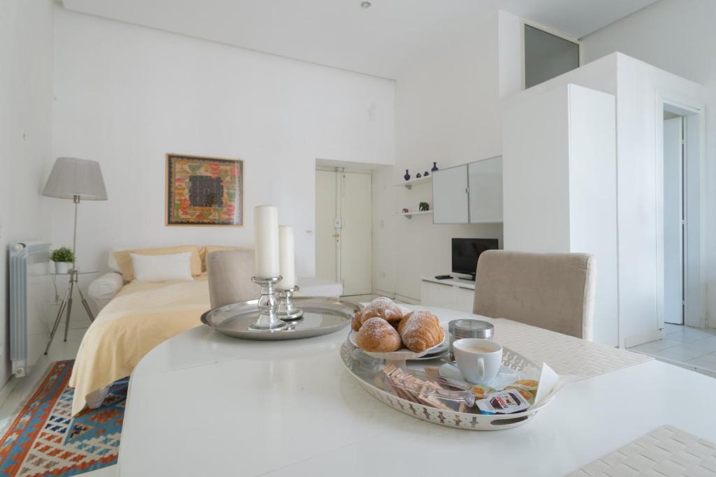 Posteľ alebo postele v izbe v ubytovaní Relais Piazza dei Martiri