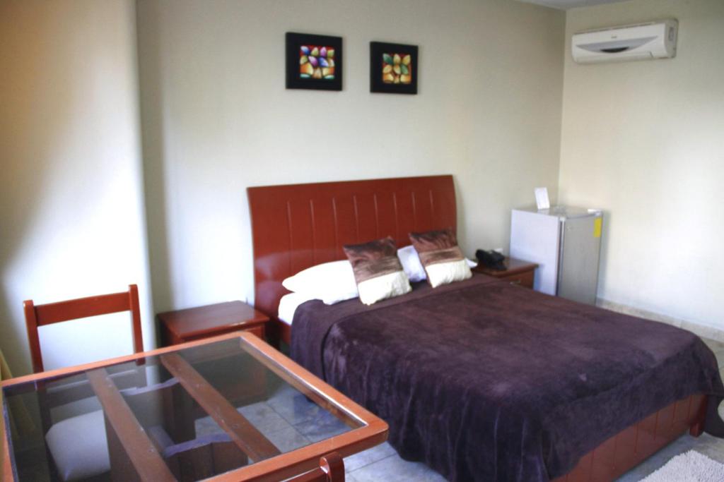 Letto o letti in una camera di Hotel Onix Gold