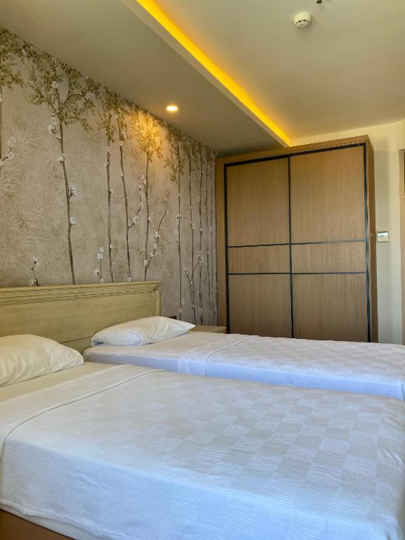 Postel nebo postele na pokoji v ubytování Hotel Mutlu