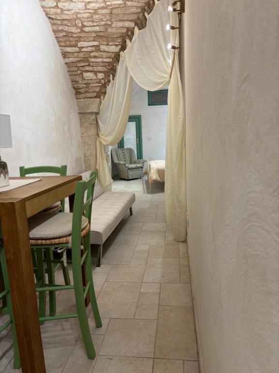 a dining room with a table and chairs at 17 per 2 in Martina Franca