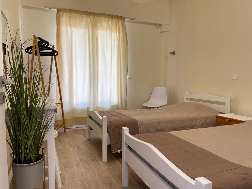 A bed or beds in a room at Kontos Mansion